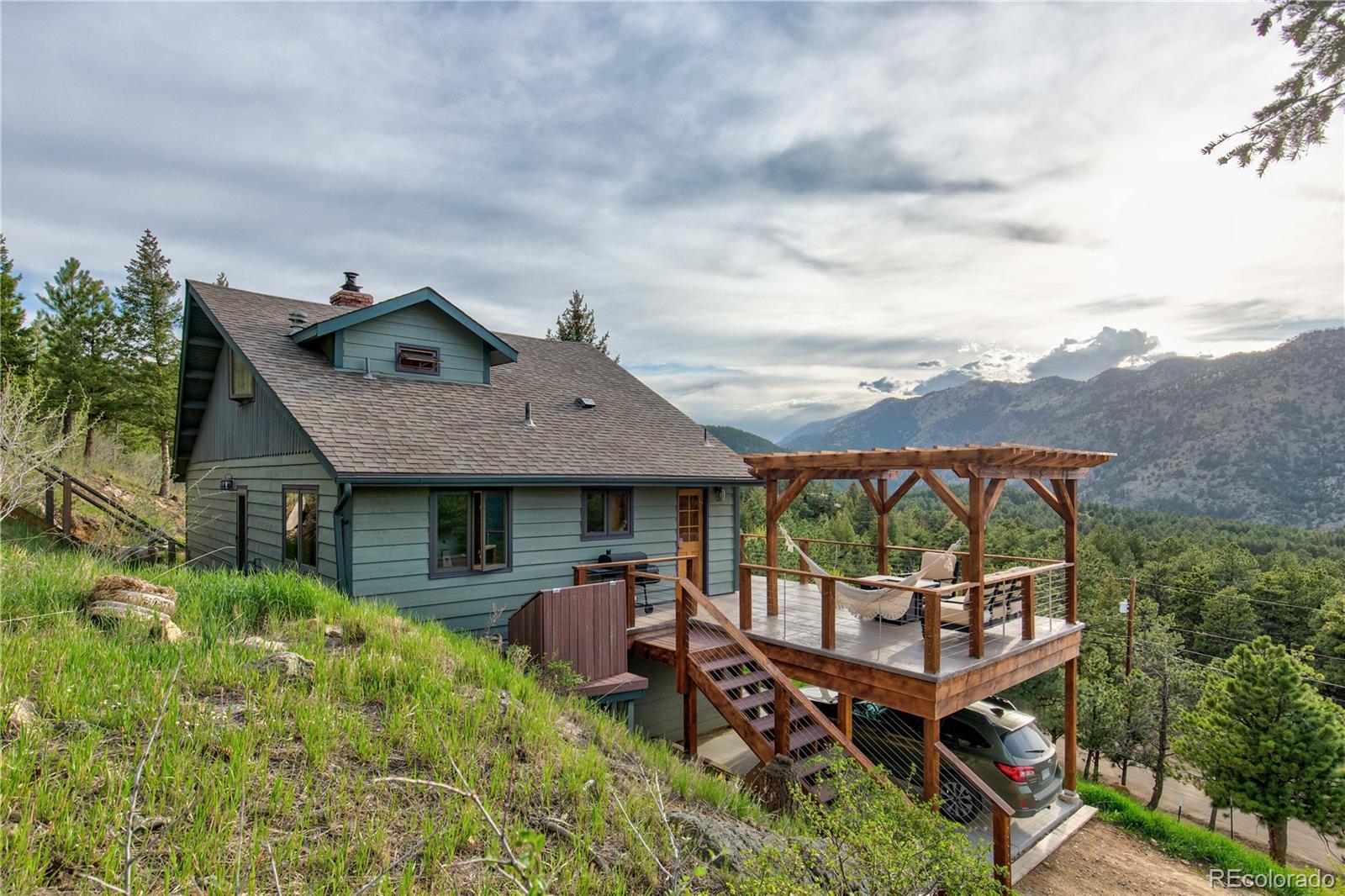 136 Elk Ridge Lane Boulder, CO 80302 - Photo 1 of 27 an aerial view of a house with swimming pool and furniture