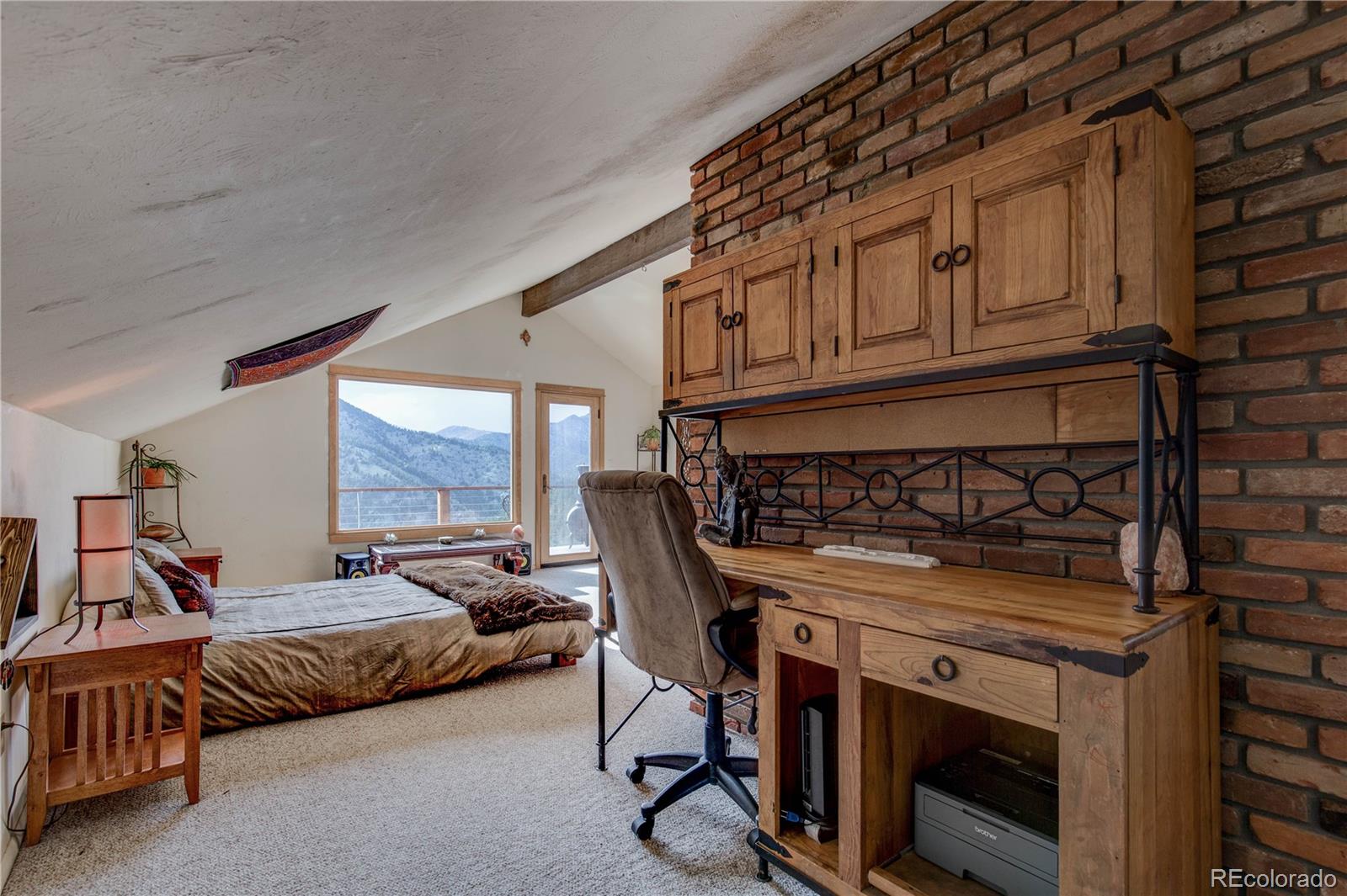 136 Elk Ridge Lane Boulder, CO 80302 - Photo 11 of 27 a view of a livingroom with furniture and windows