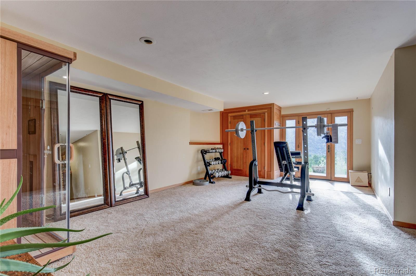 136 Elk Ridge Lane Boulder, CO 80302 - Photo 20 of 27 a view of a room with gym equipment