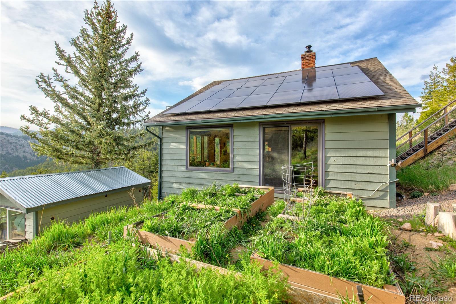 136 Elk Ridge Lane Boulder, CO 80302 - Photo 21 of 27 a front view of a house with garden