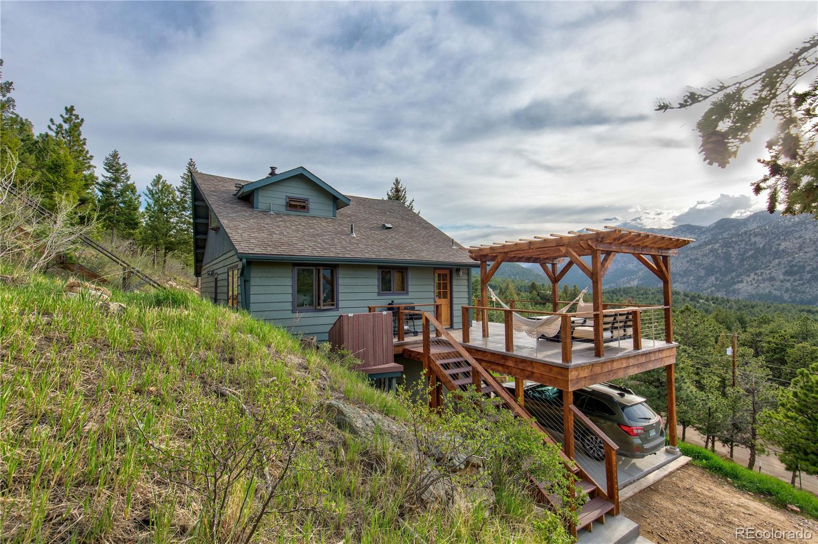 136 Elk Ridge Lane Boulder, CO 80302 - Photo 27 of 27 an aerial view of a house with garden space and deck