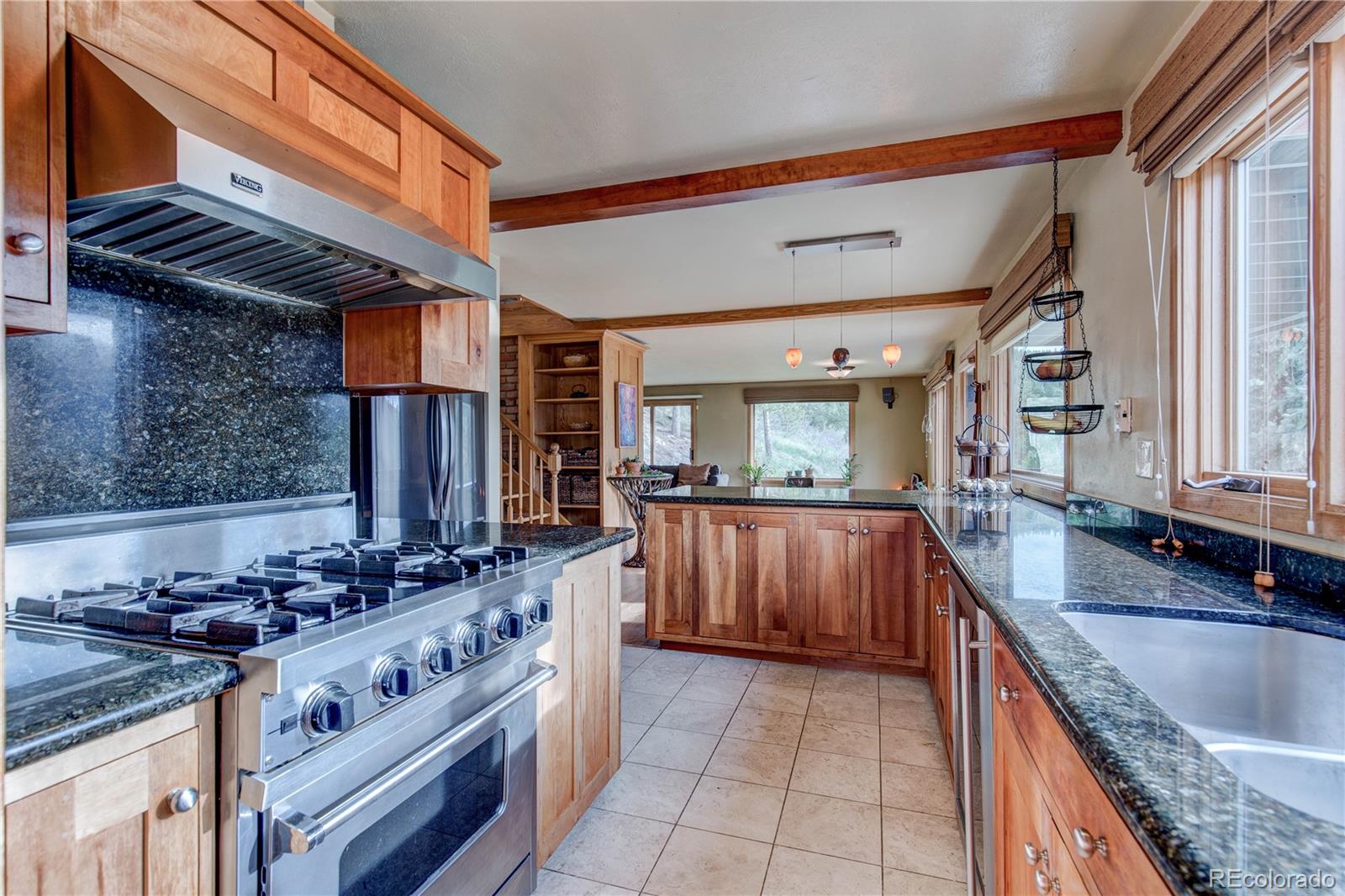 136 Elk Ridge Lane Boulder, CO 80302 - Photo 6 of 27 a kitchen with stainless steel appliances granite countertop a sink and a stove