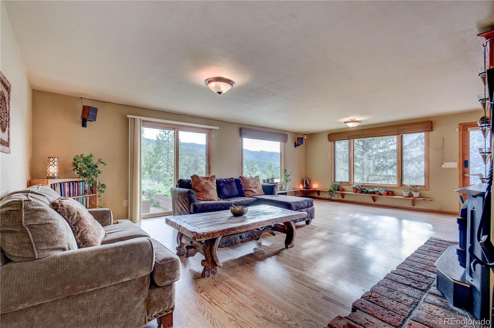 136 Elk Ridge Lane Boulder, CO 80302 - Photo 8 of 27 a living room with furniture and a large window