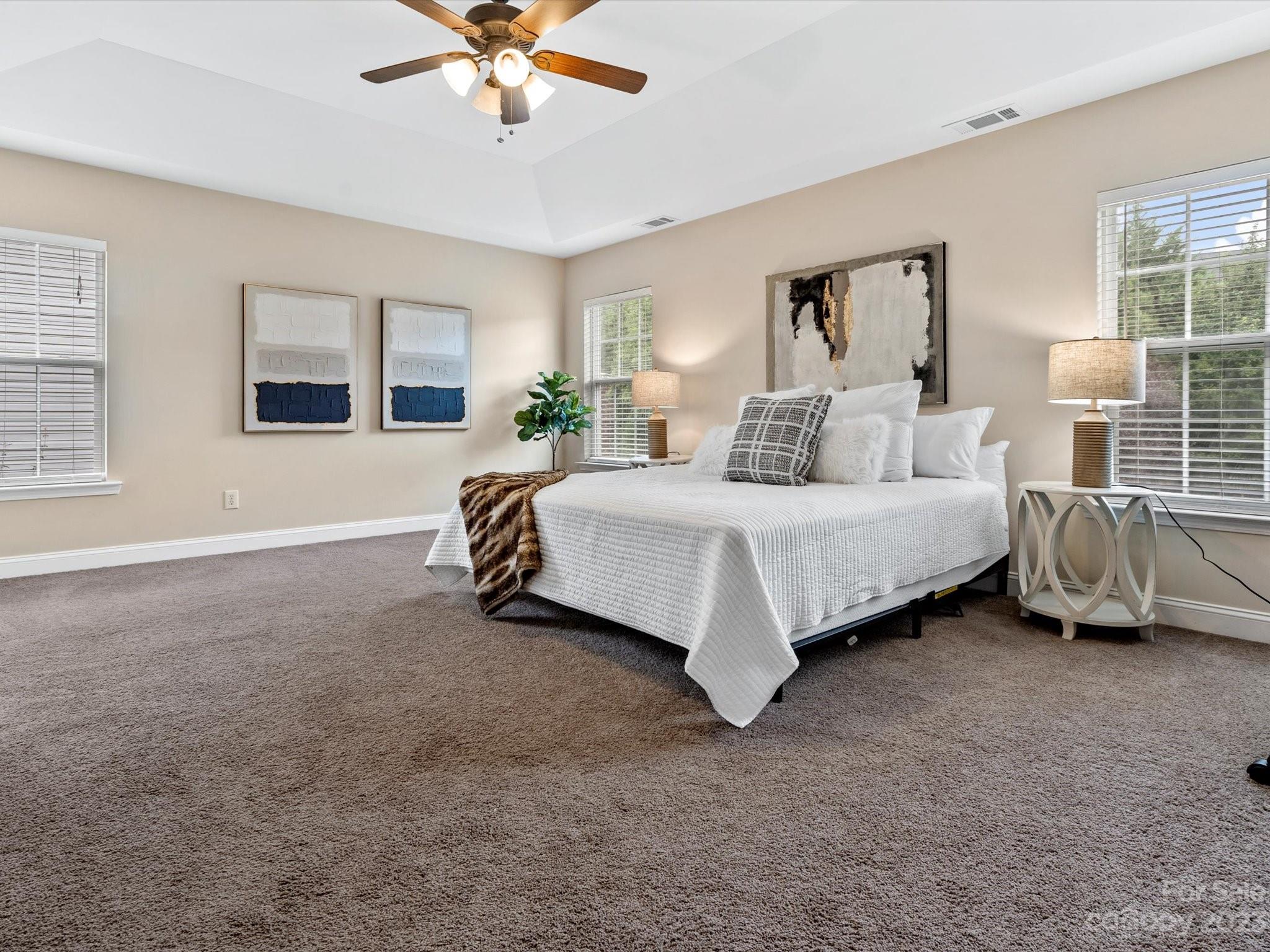 9300 Seamill Road Charlotte, NC 28278 - Photo 17 of 28 a bedroom with a bed and glass door