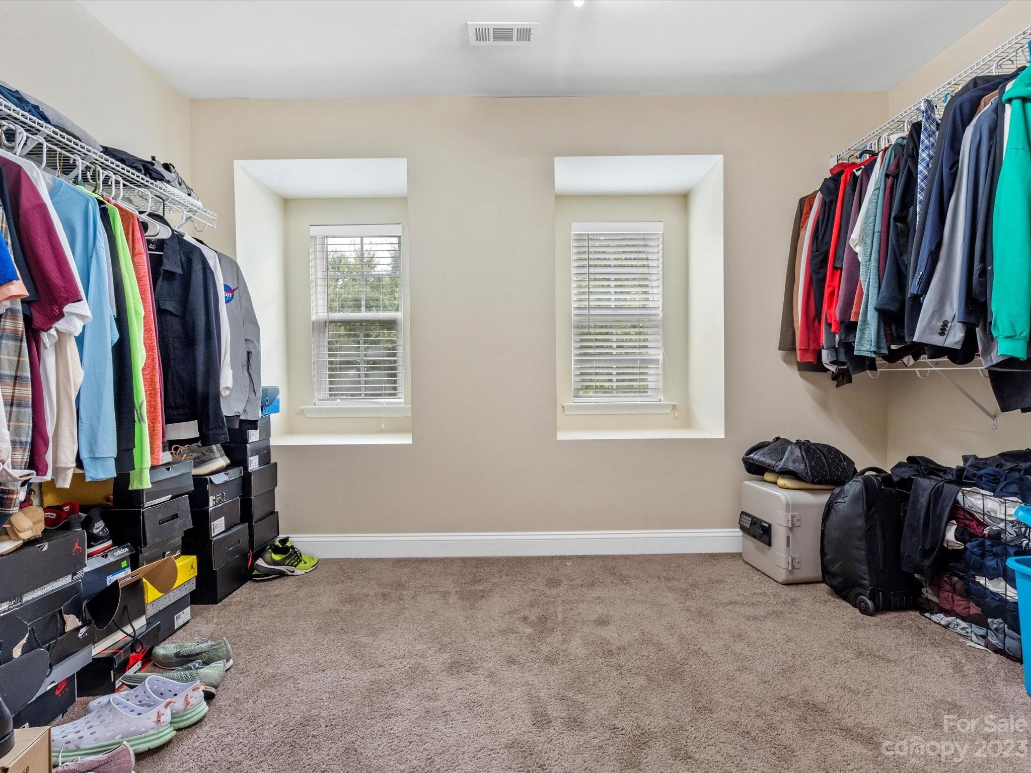 9300 Seamill Road Charlotte, NC 28278 - Photo 21 of 28 a view of walk in closet with clothes and shoes