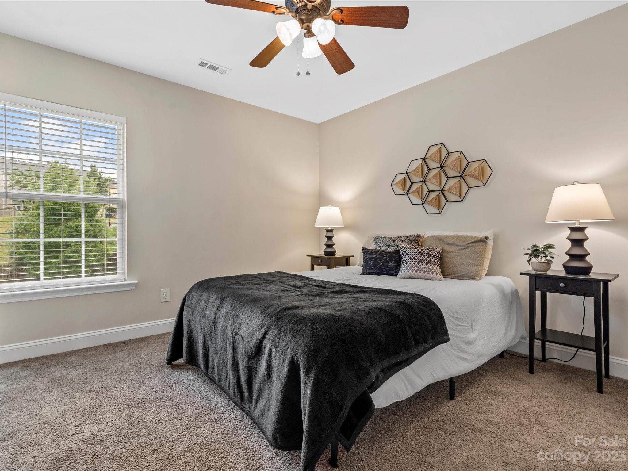 9300 Seamill Road Charlotte, NC 28278 - Photo 22 of 28 a spacious bedroom with a bed and a window