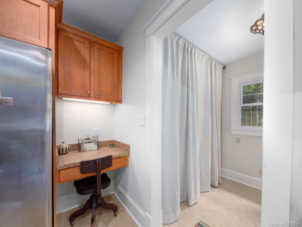 36 Sayles Road Asheville, NC 28803 - Photo 15 of 26 a workspace with cabinets and a window