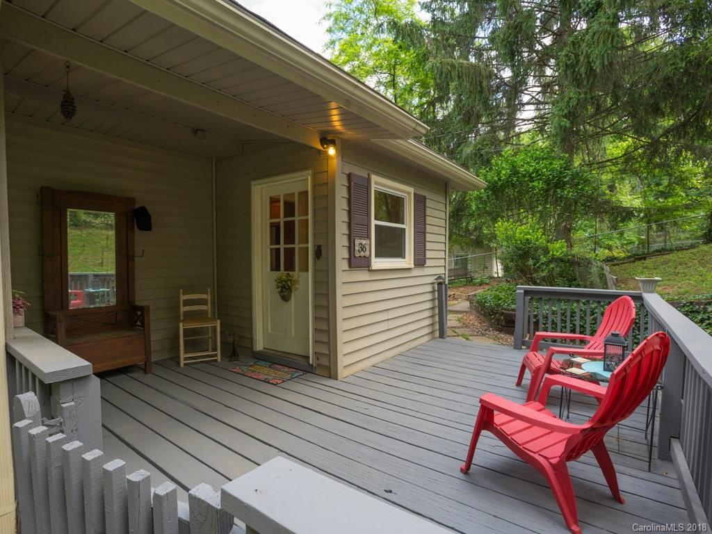 36 Sayles Road Asheville, NC 28803 - Photo 3 of 26 a balcony with wooden floor table and chairs