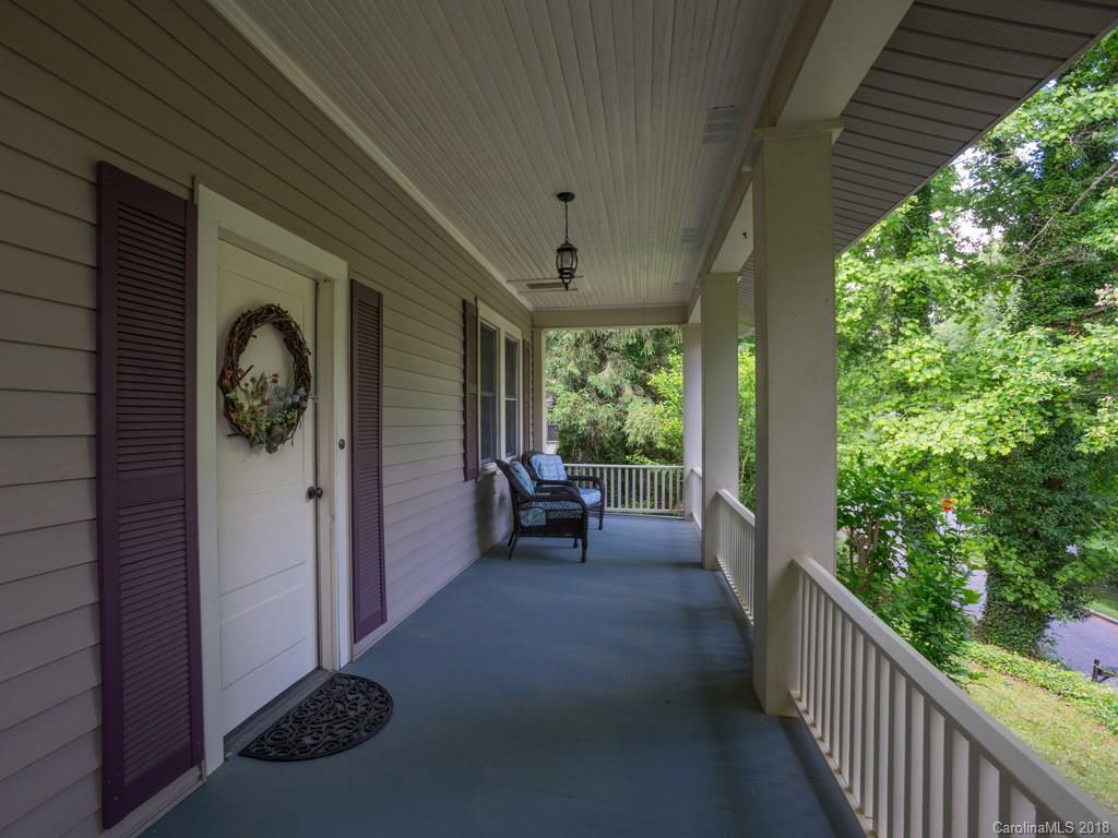 36 Sayles Road Asheville, NC 28803 - Photo 25 of 26 a view of a porch with furniture and floor to ceiling window