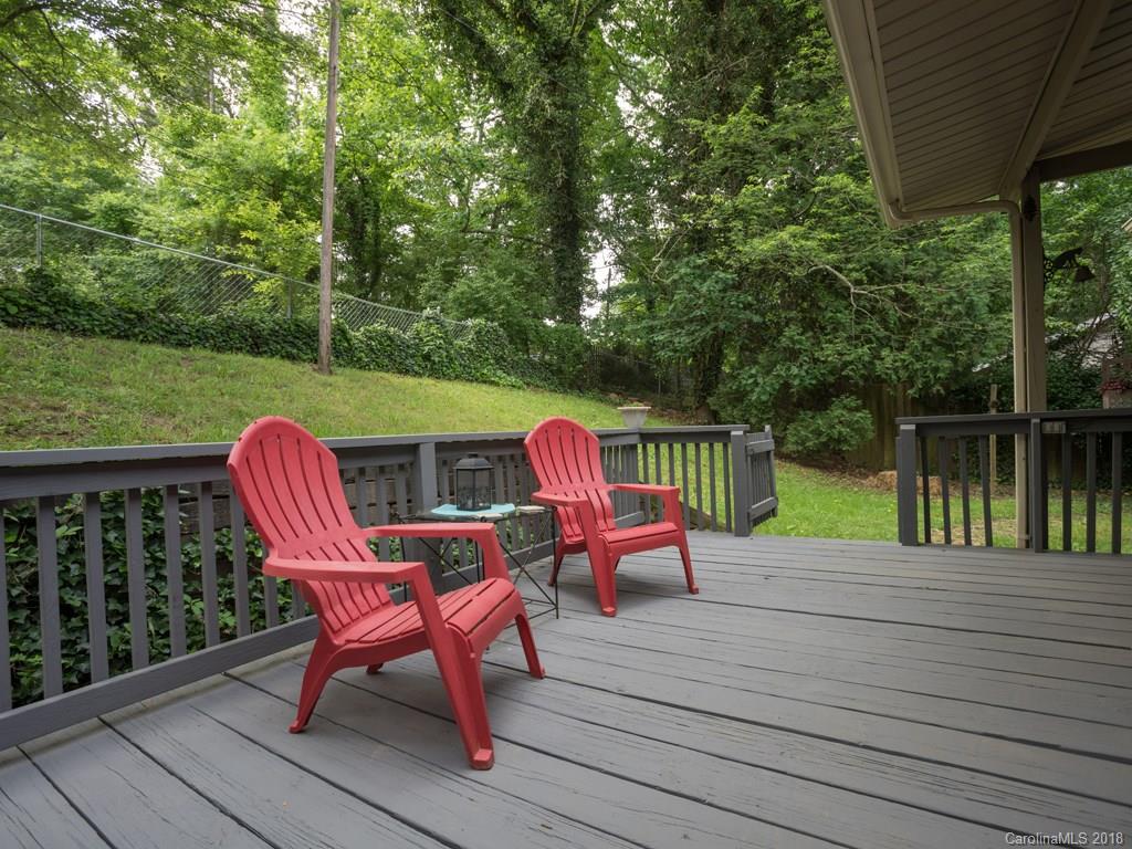 36 Sayles Road Asheville, NC 28803 - Photo 4 of 26 a view of a deck with two chairs and a table