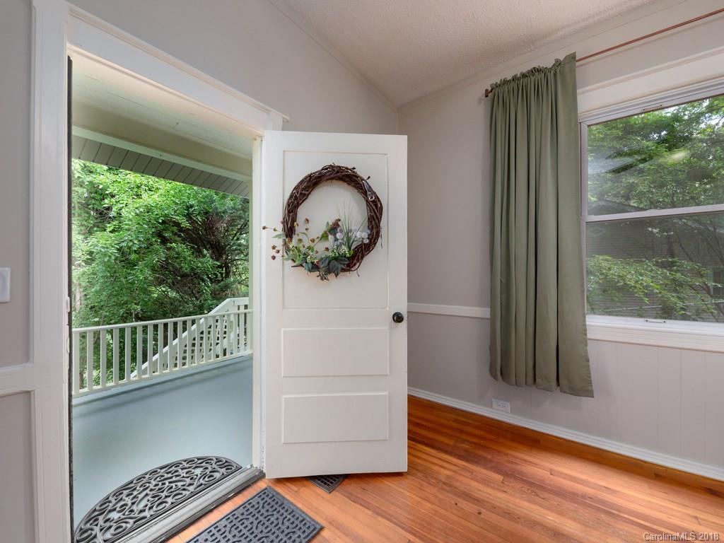 36 Sayles Road Asheville, NC 28803 - Photo 7 of 26 a view of a hardwood & floor to ceiling window