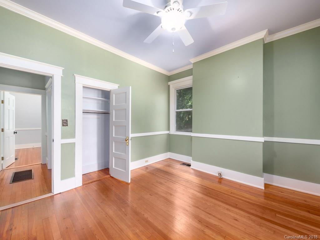 36 Sayles Road Asheville, NC 28803 - Photo 9 of 26 wooden floor in an empty room with a window