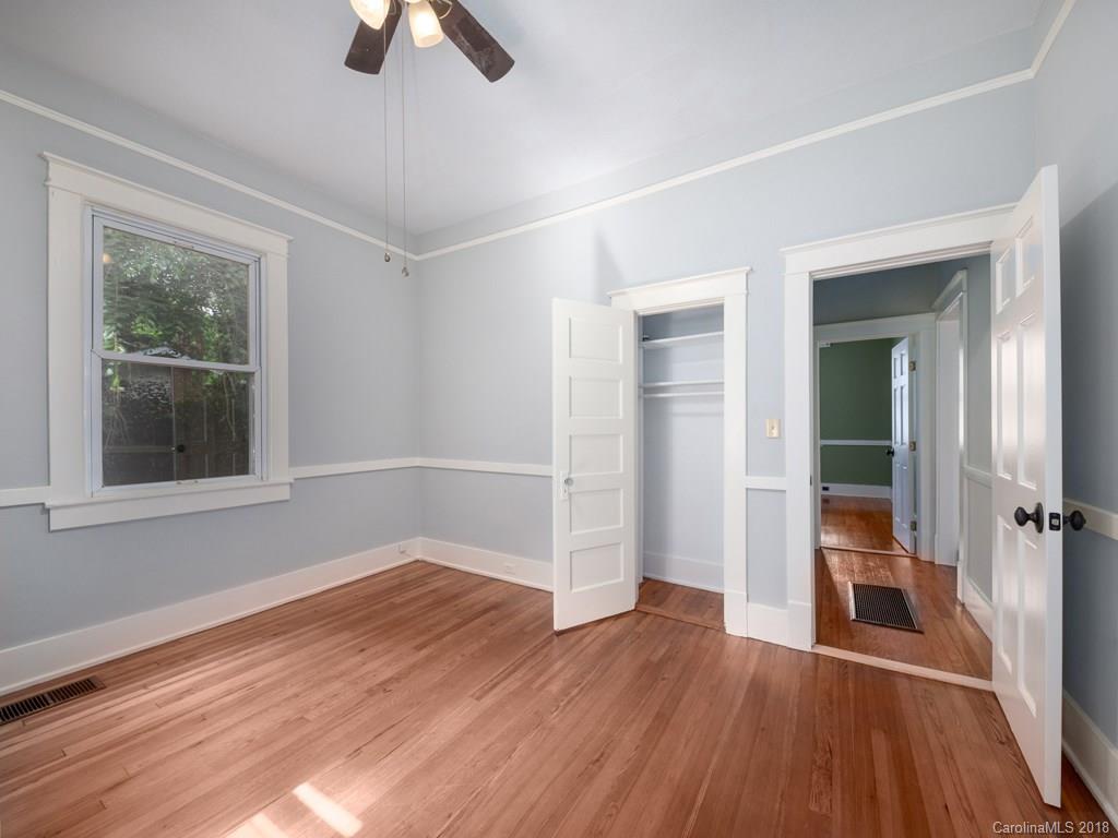 36 Sayles Road Asheville, NC 28803 - Photo 10 of 26 wooden floor in an empty room with a window