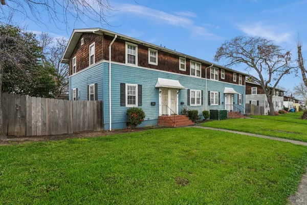 a view of a chair and tables in the patio