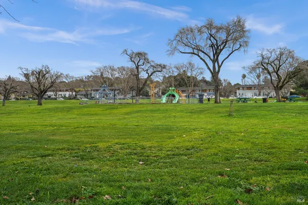 a backyard of a house with lots of green space