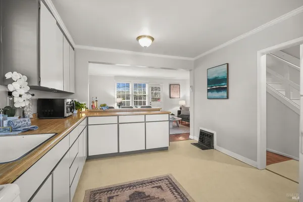 a kitchen with stainless steel appliances granite countertop a sink and cabinets