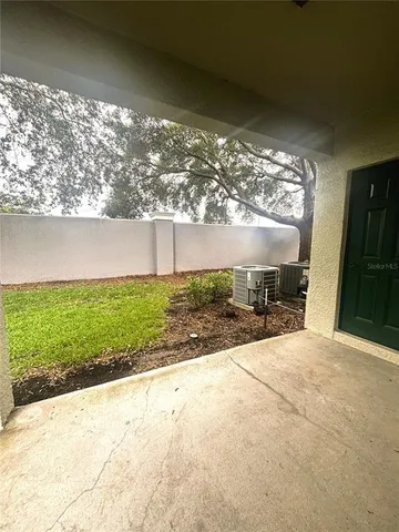 a view of backyard with garden and outdoor seating