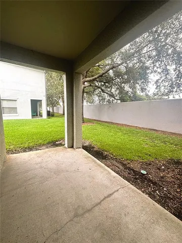 a view of a porch with a yard