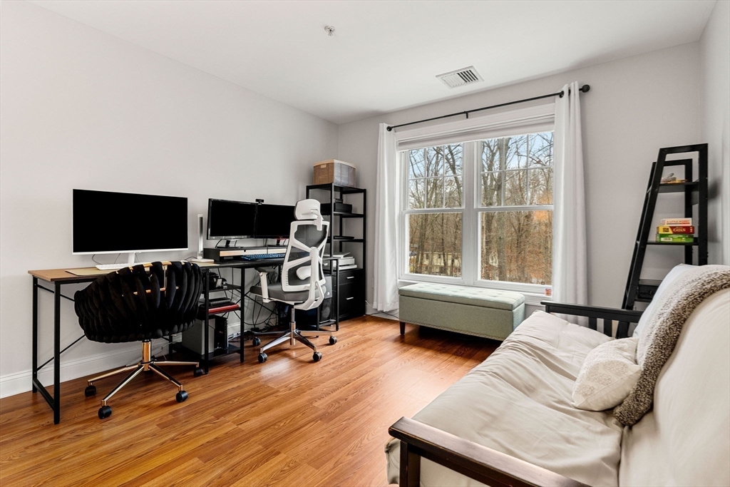 19 Broad Street, Unit 203 Merrimac, MA 01860 - Photo 13 of 22 a view of a livingroom with workspace and a window