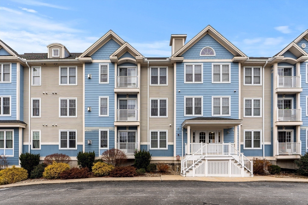 19 Broad Street, Unit 203 Merrimac, MA 01860 - Photo 19 of 22 a front view of a residential houses