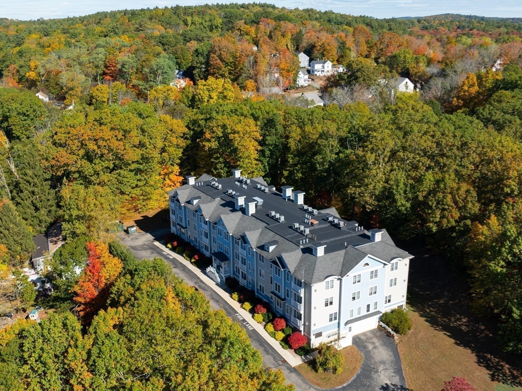 19 Broad Street, Unit 203 Merrimac, MA 01860 - Photo 20 of 22 an aerial view of residential houses with outdoor space