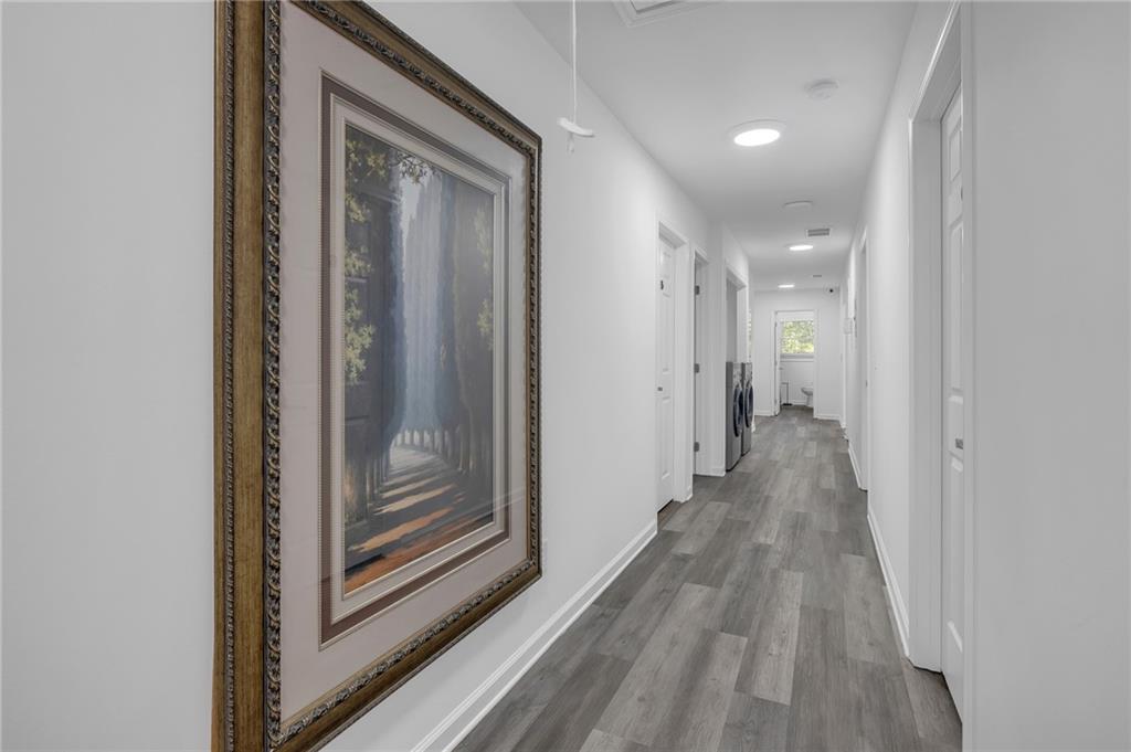 344 East Rhinehill Road Southeast Atlanta, GA 30315 - Photo 14 of 29 a view of a hallway with wooden floor and closet