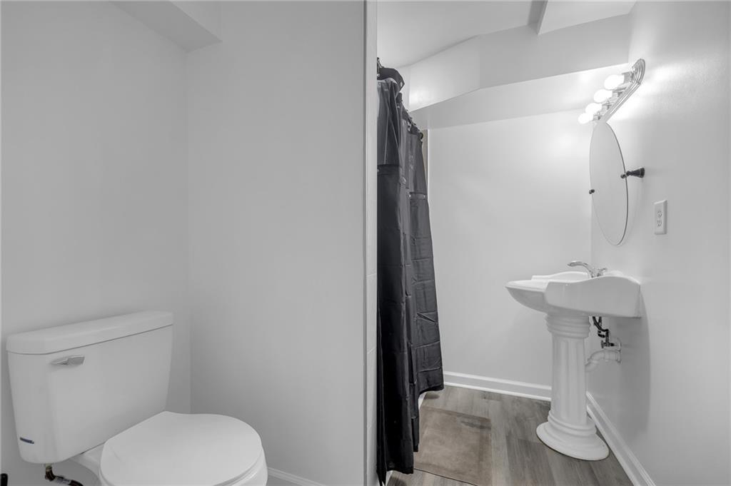 344 East Rhinehill Road Southeast Atlanta, GA 30315 - Photo 20 of 29 a bathroom with a toilet and a sink