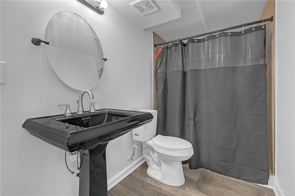 344 East Rhinehill Road Southeast Atlanta, GA 30315 - Photo 21 of 29 a bathroom with a sink toilet and shower