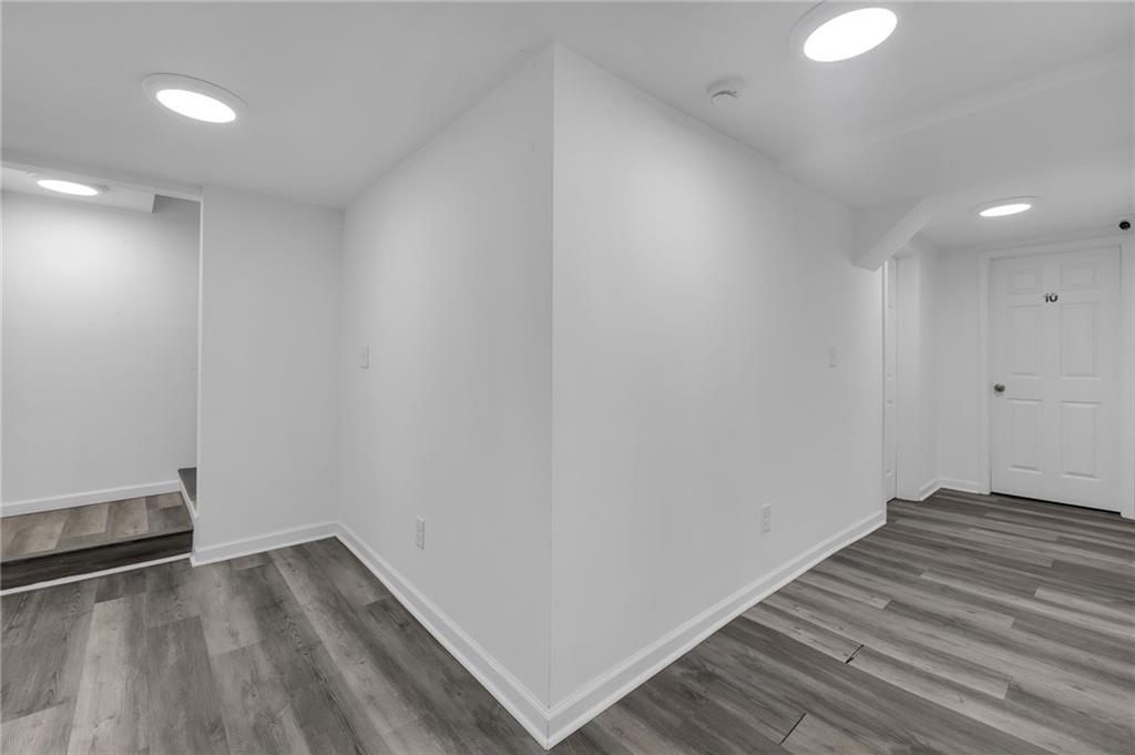 344 East Rhinehill Road Southeast Atlanta, GA 30315 - Photo 23 of 29 a view of wooden floor and windows in a room