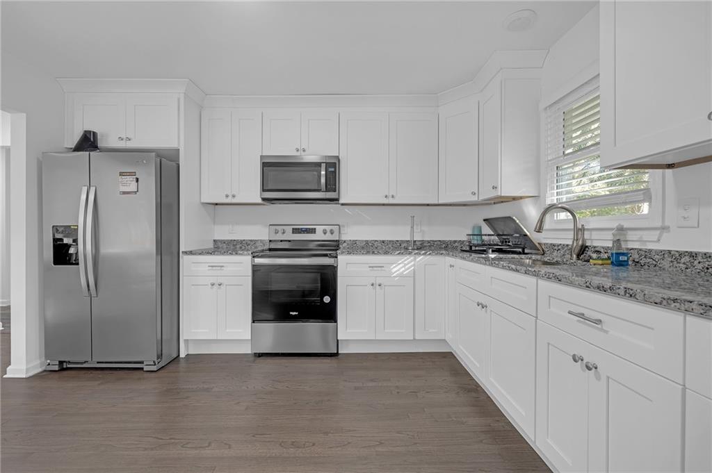 344 East Rhinehill Road Southeast Atlanta, GA 30315 - Photo 7 of 29 a kitchen with cabinets stainless steel appliances and a counter space