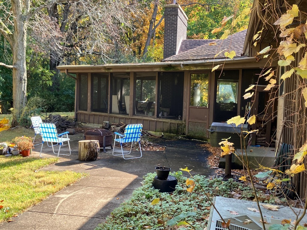 27125 North Williams Park Road Wauconda, IL 60084 - Photo 12 of 19 a view of a patio with table and chairs with wooden fence and plants