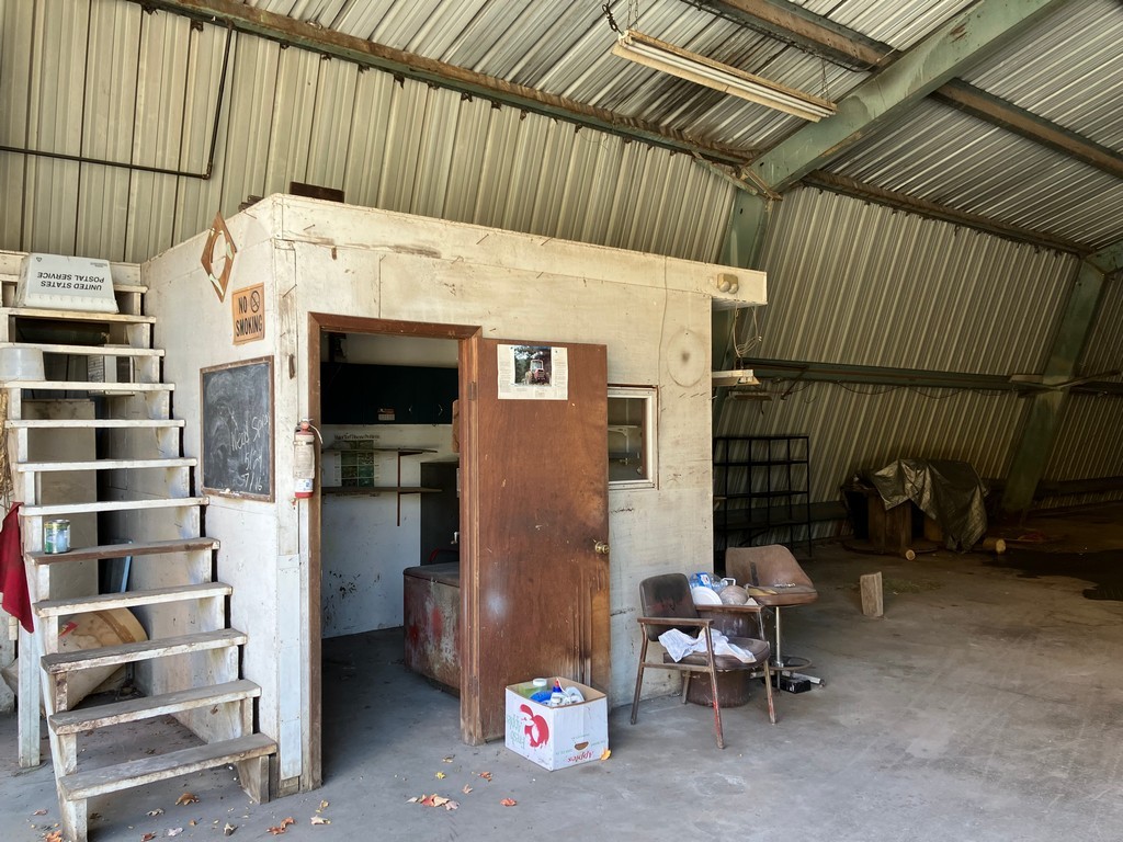 27125 North Williams Park Road Wauconda, IL 60084 - Photo 18 of 19 a view of a patio with table and chairs with wooden fence and plants