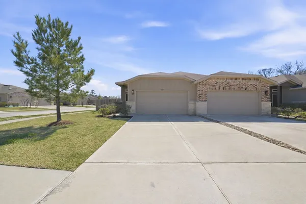 a view of a large building with trees in the background