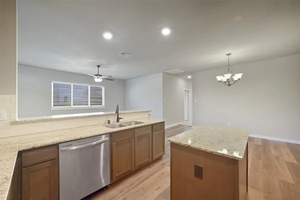 a kitchen with a sink stove and microwave