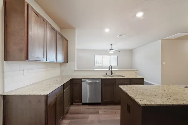 a kitchen with a sink and cabinets