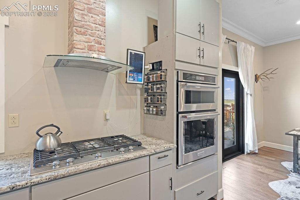8450 Edison Road Yoder, CO 80864 - Photo 14 of 50 a kitchen with granite countertop a stove oven and sink