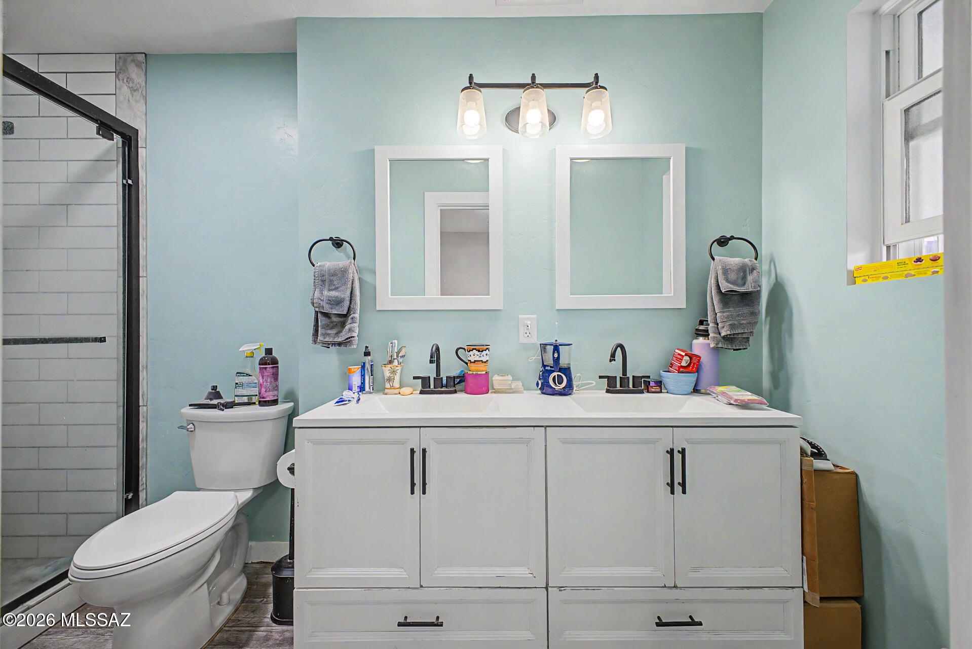 1172 East Allen Road Tucson, AZ 85719 - Photo 13 of 25 a bathroom with a sink toilet and a mirror