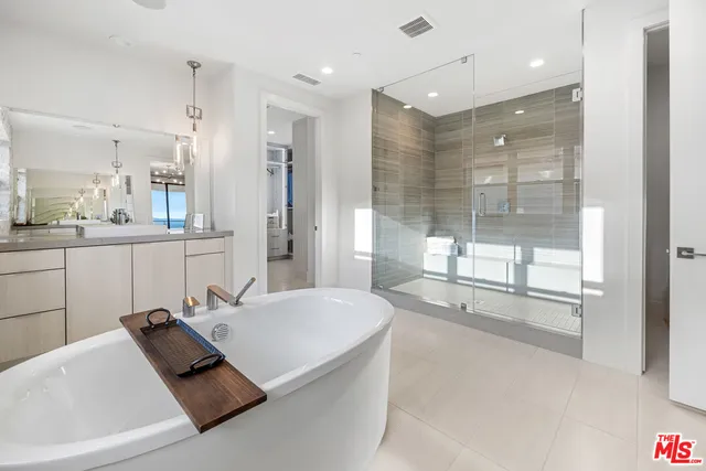 a room with cabinets and washer dryer