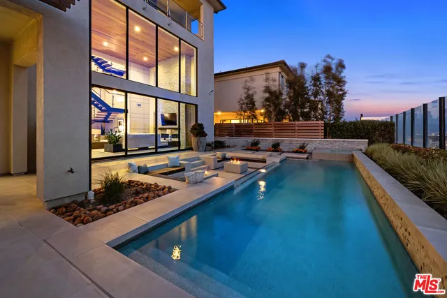a view of pool with seating space