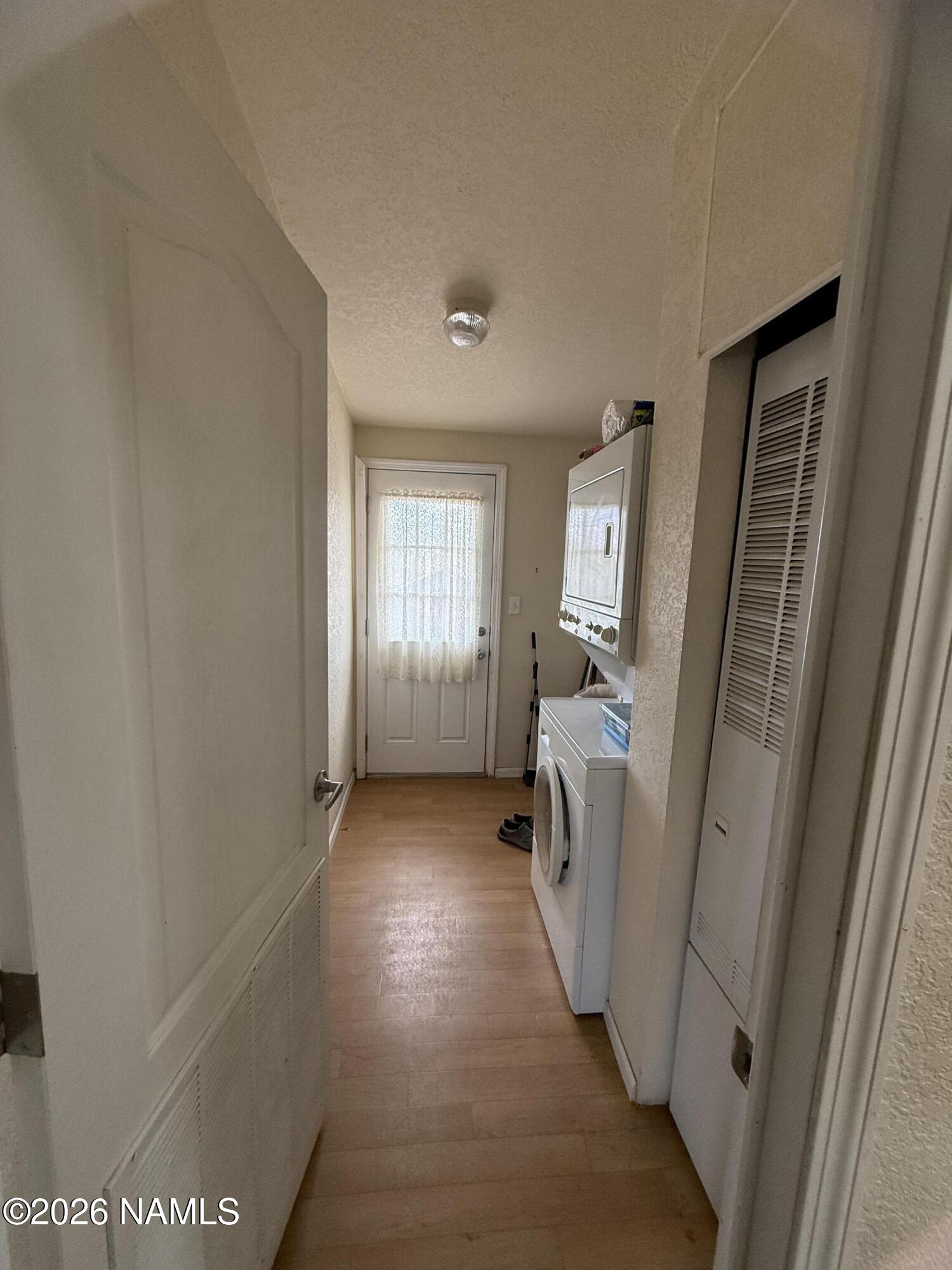 1431 East Cedar Road Williams, AZ 86046 - Photo 27 of 51 a view of a hallway in a hall with wooden floor and a window