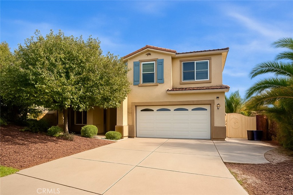 4816 Gregory Road Riverside, CA 92501 - Photo 1 of 1 a front view of a house with a yard and garage