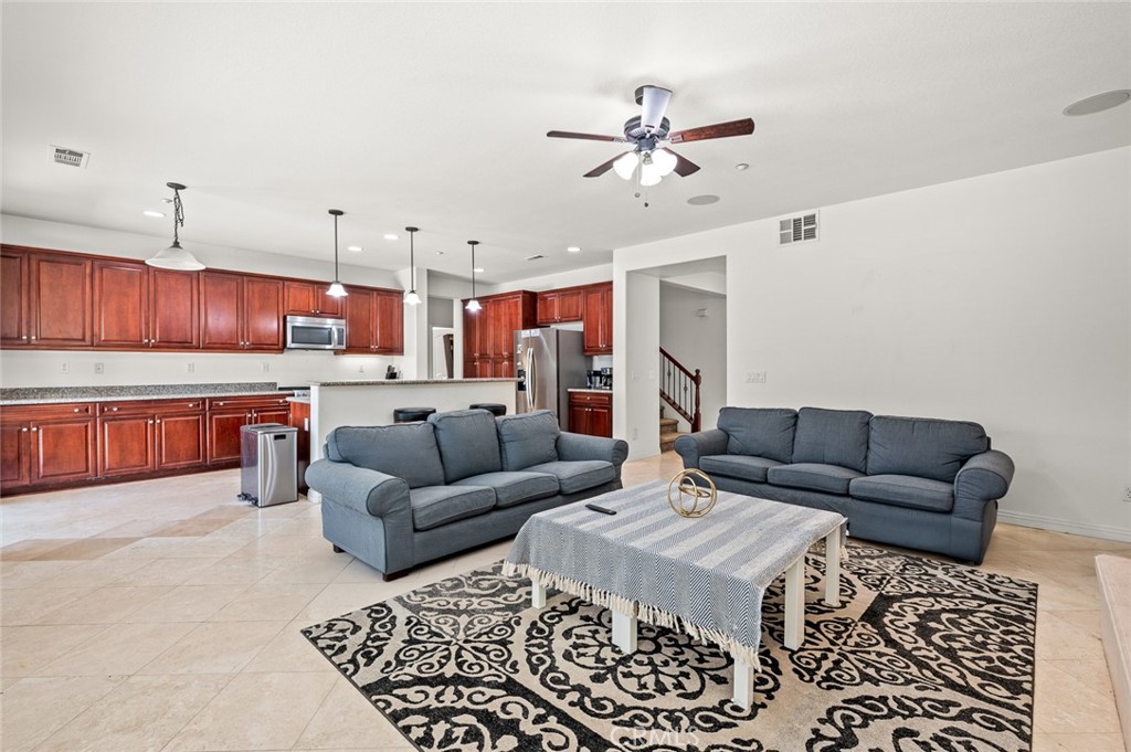 4816 Gregory Road Riverside, CA 92501 - Photo 14 of 55 a living room with furniture and kitchen view