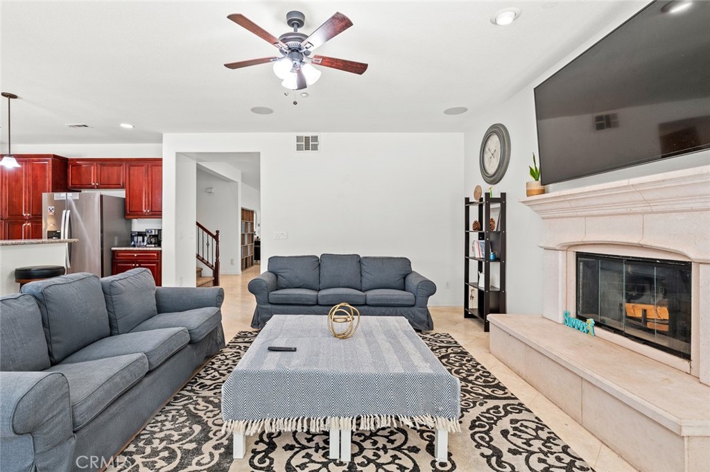 4816 Gregory Road Riverside, CA 92501 - Photo 17 of 55 a living room with furniture and a fireplace