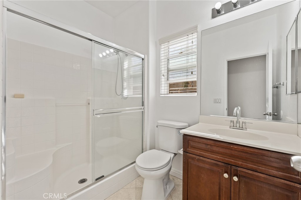 4816 Gregory Road Riverside, CA 92501 - Photo 21 of 55 a bathroom with a sink toilet and shower