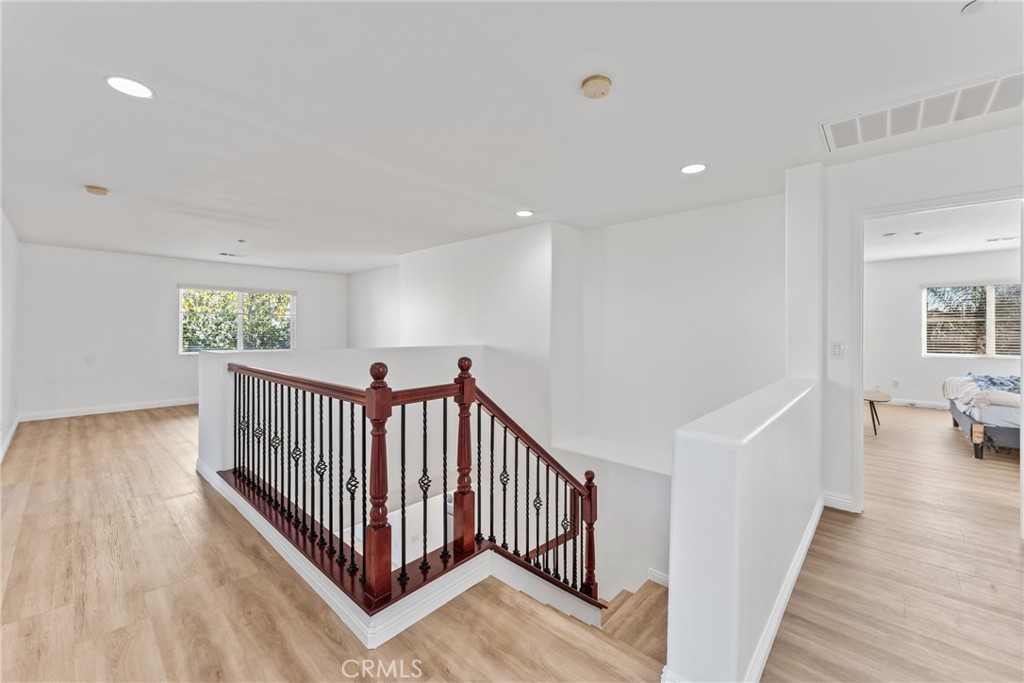 4816 Gregory Road Riverside, CA 92501 - Photo 22 of 55 a view of a hallway with windows and stairs