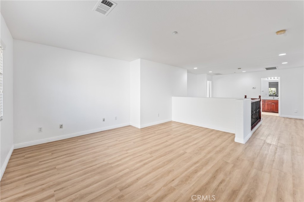 4816 Gregory Road Riverside, CA 92501 - Photo 23 of 55 a view of kitchen with kitchen island sink and wooden floor