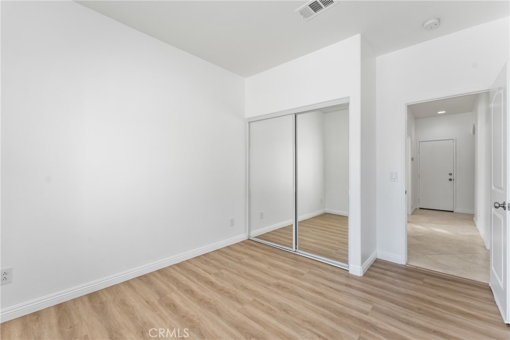 4816 Gregory Road Riverside, CA 92501 - Photo 26 of 55 a view of an empty room with wooden floor