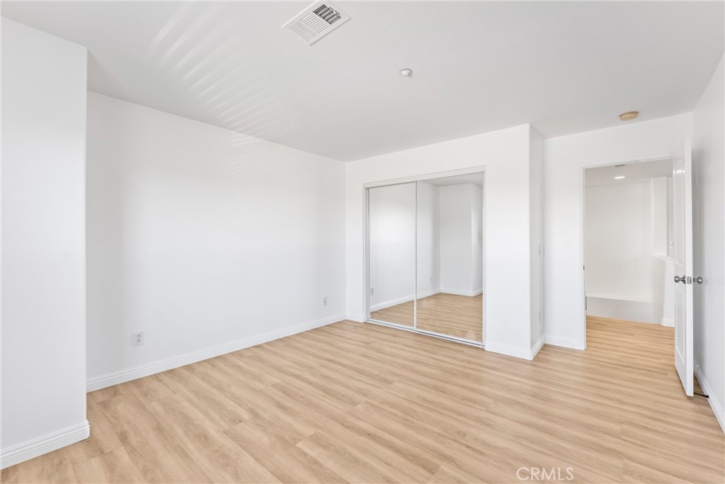 4816 Gregory Road Riverside, CA 92501 - Photo 29 of 55 a view of an empty room with wooden floor
