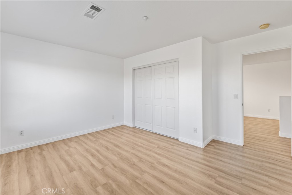 4816 Gregory Road Riverside, CA 92501 - Photo 30 of 55 a view of an empty room with wooden floor
