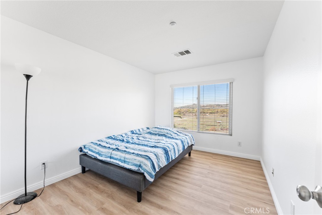 4816 Gregory Road Riverside, CA 92501 - Photo 32 of 55 a bedroom with a bed and a window